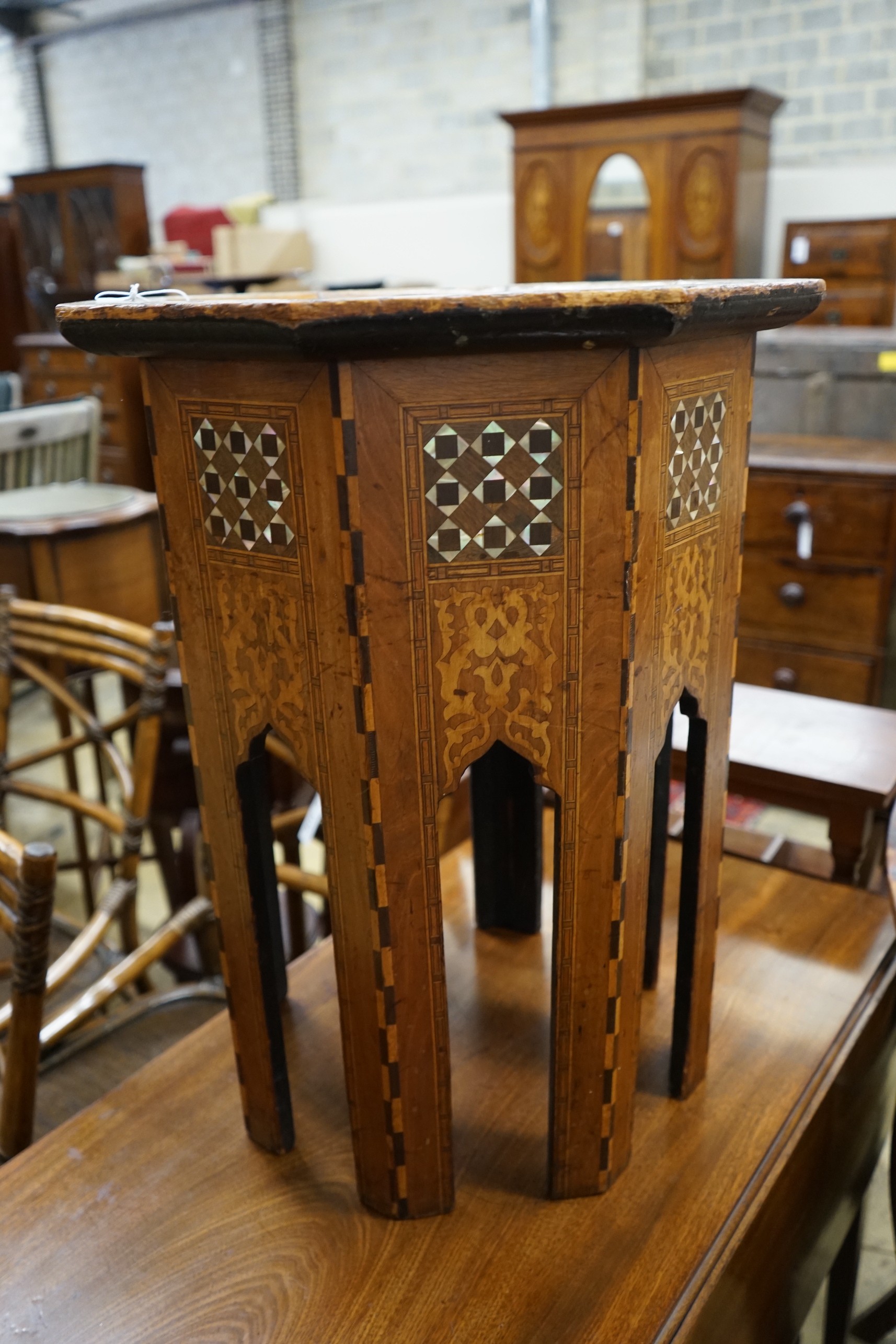 A Moorish octagonal mother of pearl inlaid centre table, width 46cm, height 62cm